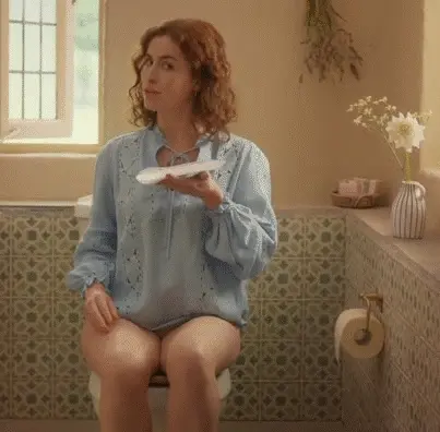 Redhead woman (Lisa O'Connor) sitting on the toilet without pants for a commercial. Slut, what you don't do to make money - Tena Discreet