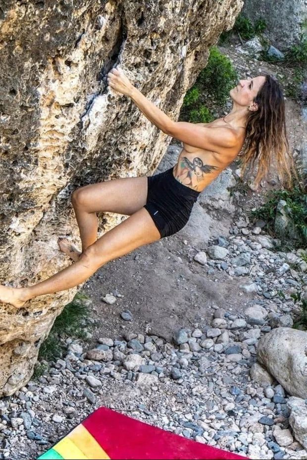 Topless milf climbing bouldering