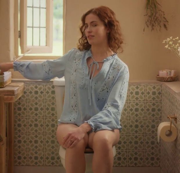 Redhead woman (Lisa O'Connor) sitting on the toilet without pants for a commercial. Slut, what you don't do to make money - Tena Discreet