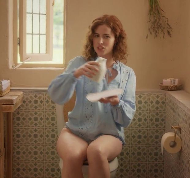 Redhead woman (Lisa O'Connor) sitting on the toilet without pants for a commercial. Slut, what you don't do to make money - Tena Discreet