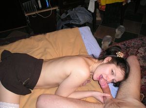 Amateur brunette sucking a big cock in bed