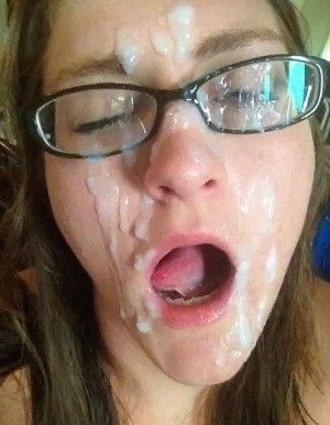 Huge cum facial on chick with glasses