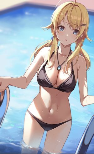 Sexy blonde with big tits in a pool