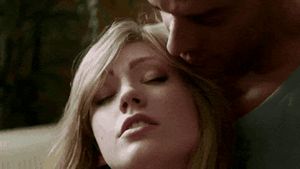 He’s playing with her nipples…