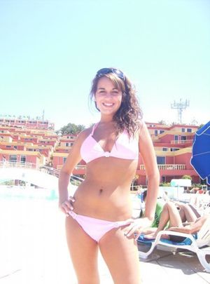 Sarah Byrne in sexy pink bikini on holiday beach