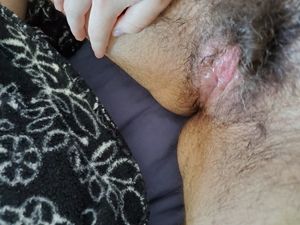 Been masturbating my wet hairy vulva and she's ready to cum