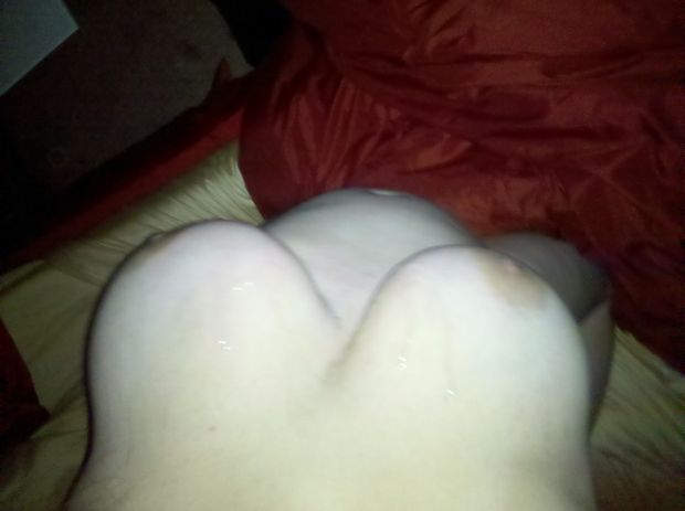 Chubby whore Jenn Amburgey showing off her huge tits with a fresh cumshot on them
