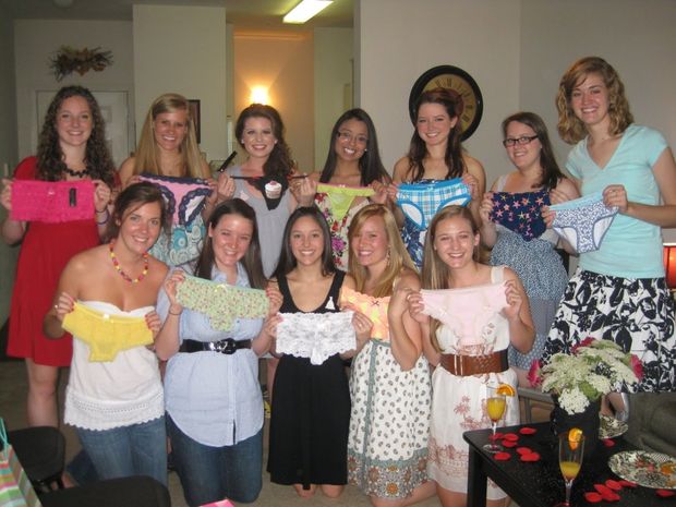 Holding the underwear they'll wear when you fuck them