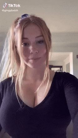 Gorgeous redhead with huge tits