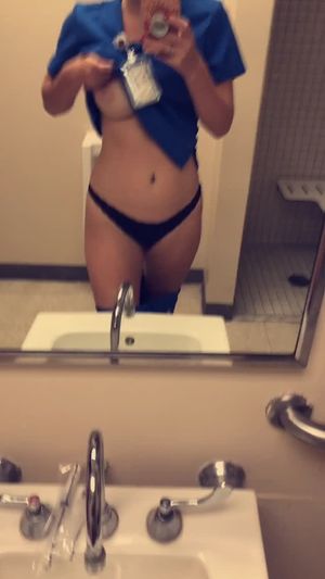 Big titty blonde nurse showing tits in hospital bathroom