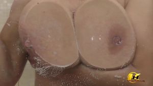 Wet tits against shower glass