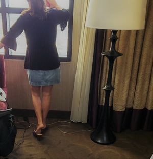 Wife posing for me at hotel window.