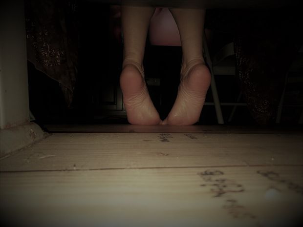 Wife's feet from under seat in home theater (watching porn).
