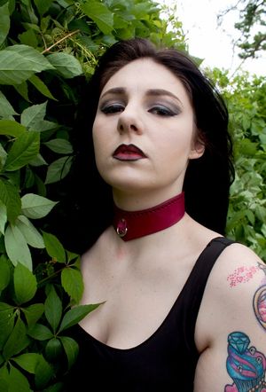 Collared - other than black, red is is her favorite color.