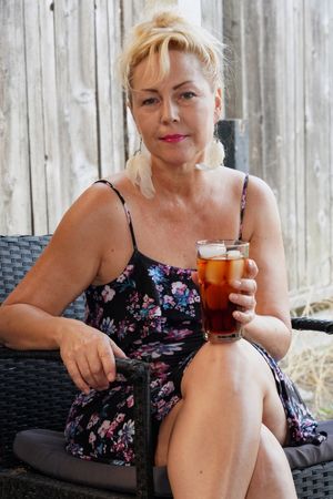 Mother loves ice cold drinks when it's hot.