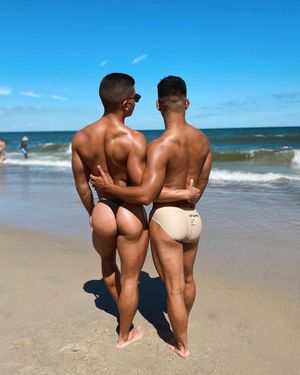 Lovers hold closer at the beach