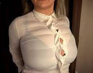 Not only is the blouse too small but you can clearly see her bra thru it. So humiliating.