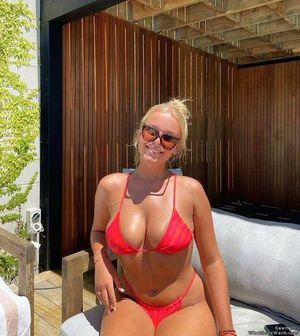Big tits blonde in bikini looking hot as fuck