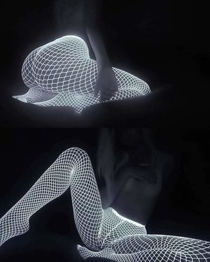 Glow in the dark fishnet stockings - great legs and ass