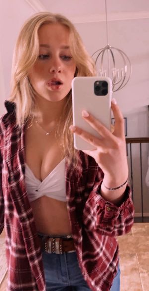 Blonde hallway selfie cleavage