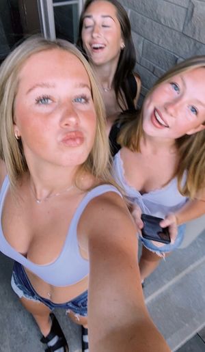 Three teens selfie on porch