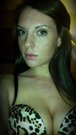Green-eyed, freckle faced Stunner