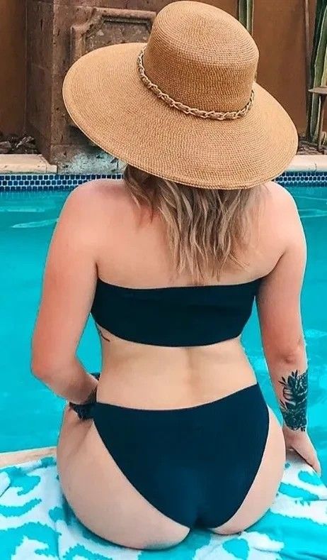 Gorgeous blonde sitting by the pool