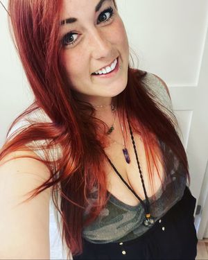 Sexy redhead with natural tits