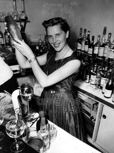 Minka greets customers at her bar