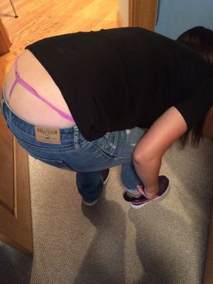 Cutie exposes her pink thong when she bends down to put her trainers on....x