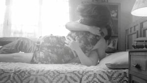 B&W rolling over in bed