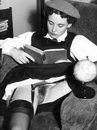 Zelda, victim, examines mug shot book.