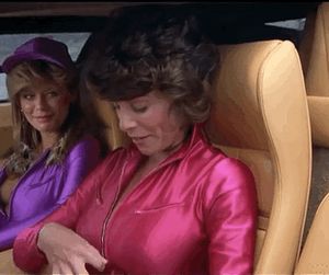 Adrienne Barbeau unzipping her suit