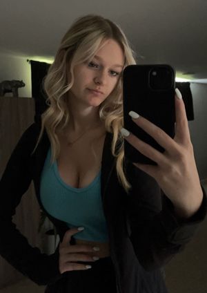 Teen selfie green top cleavage