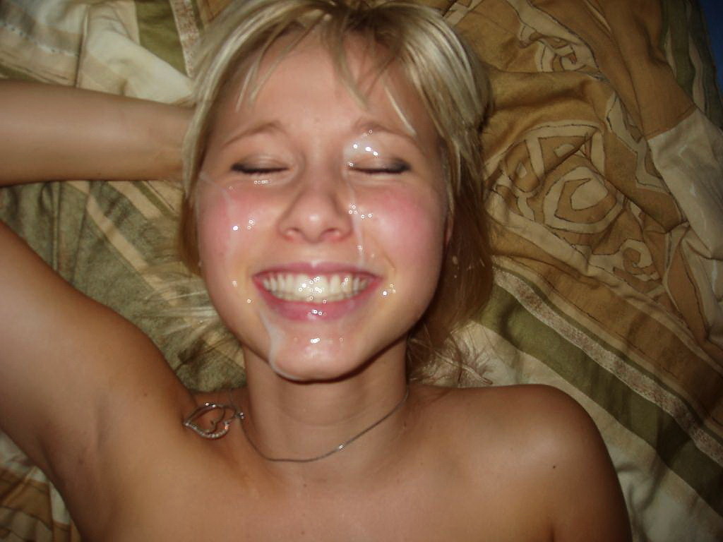 Splattered in splooge and smiling from ear to ear
