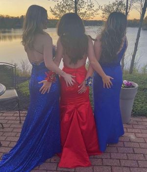 Three teens at prom touching ass