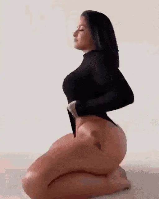 Thick beauty shakes ass in bodysuit