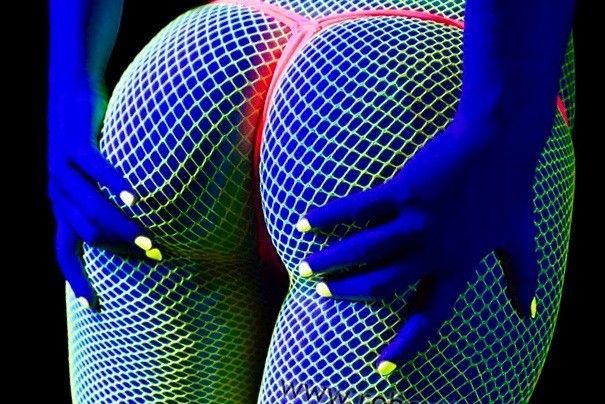 Hot after dark neon fishnet stockings and g-string.
