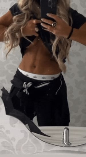 WWE Legend Trish Stratus showing off her Beautiful Abs