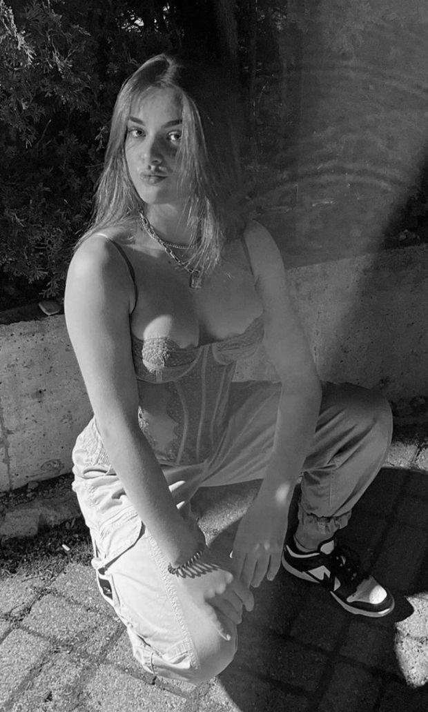 Brunette bustier on haunches