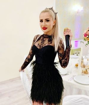 Blonde bimbo in black lace dress