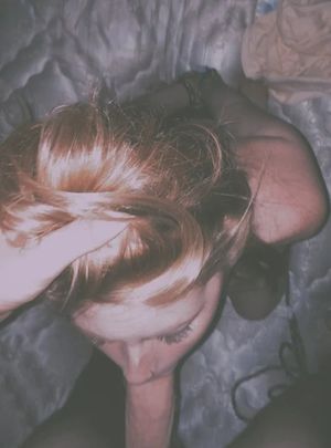 Amateur brunette in handcuffs sucking dick on her knees