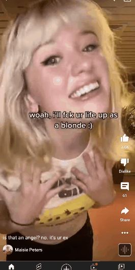 Petite blonde with mouth open twirls