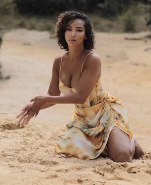 Sweet ebony queen playing in the sand