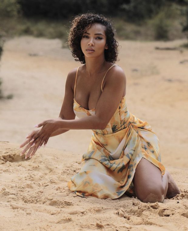 Sweet ebony queen playing in the sand
