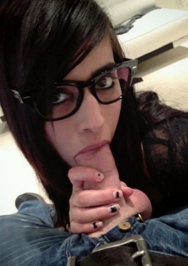 Amateur brunette with glasses and a cock in her mouth