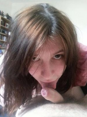 Amateur brunette licking an uncut cock