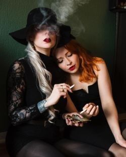 It is more witchery, what with the hat and the smoking and the lips and god it's fucking sexy...
