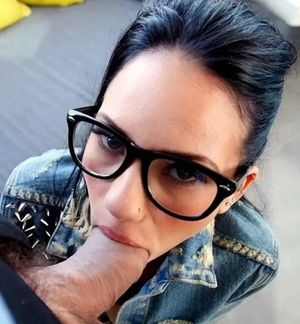 Brunette amateur with glasses and cock in her mouth