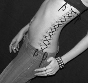 Pierced corset looks creepy but just fucking hot